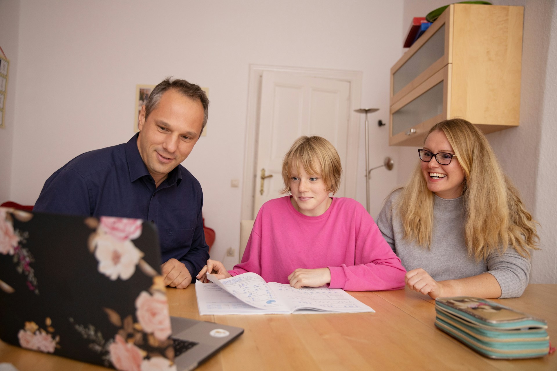 Family helping child with homework