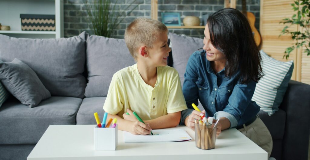 Mother and son drawing together